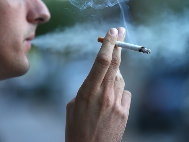 A man smokes a cigareete in Sydney Australia.                       Cameron Spencer