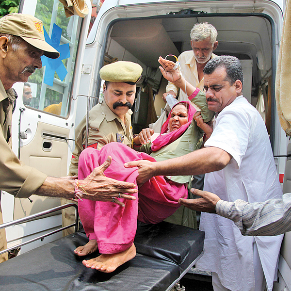 A woman injured in firing by Pakistani Rangers being brought for treatment at the government hospital in Jammu on Wednesday 
    
    AP