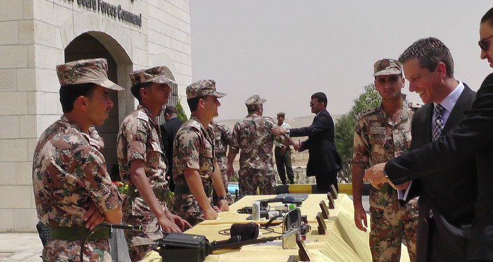 Members of the Jordanian border guard left stand behind a table where various devices for first detection of possible chemical or biological weapons materials are displayed for visitors at their headquarters near the city of Zarqa Jordan