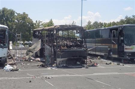 Buses that were damaged in a bomb blast on Wednesday are seen outside Burgas Airport