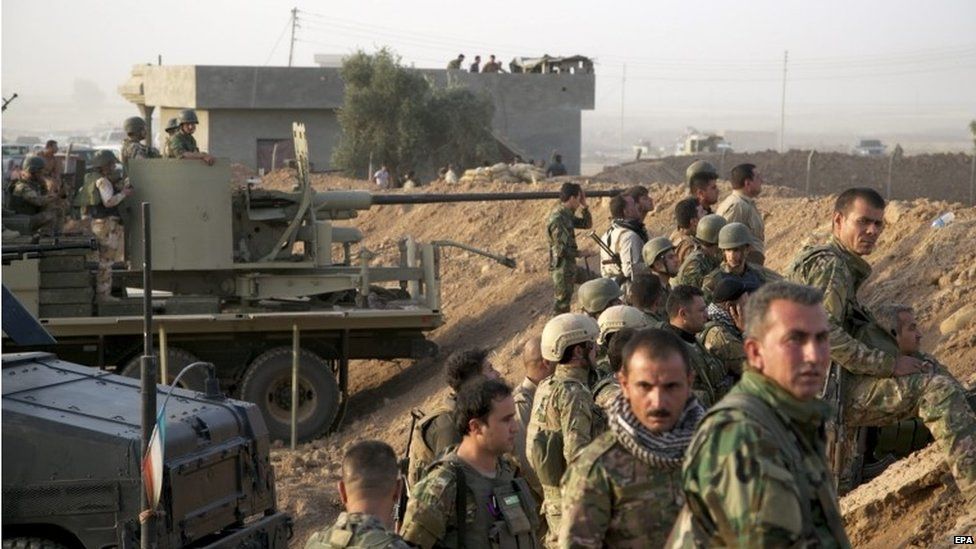 Kurdish Peshmerga soldiers take up positions south of Kirkuk northern Iraq 06 July 2015