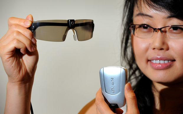 Researcher Mandy Li displays a prototype bionic eye designed to help patients suffering from degenerative vision loss caused by retinitis pigmentosa and age-related macular degeneration at University of Melbourne