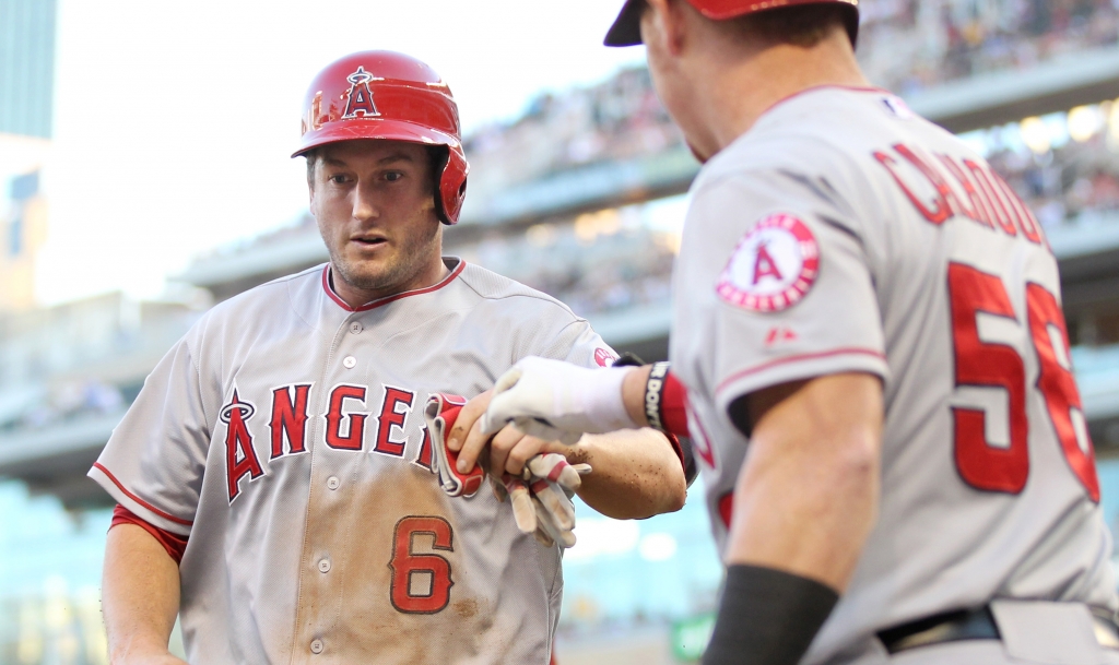 David Freese of the Angels left is congratulated by Kole Calhoun after scoring a run against the Twins in September. The Associated Press is reporting that the Angels have re-signed the third baseman to a one-year contract. (credit Andy Clayton-King  Ge