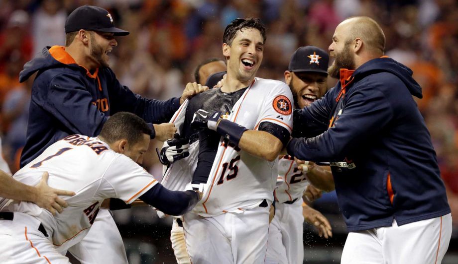 Houston Astros rip the jersey off Jason Castro center after he hit a walkoff three-run home run to defeat the Los Angeles Angels 3-0 in the ninth inning of a baseball game Thursday