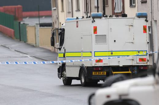 Army bomb disposal officers attend the scene on Victoria Street after a call to the Samaritans saying a bomb had failed to detonate