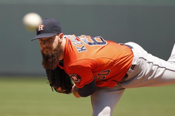 Houston Astros pitcher Dallas Keuchel warms up