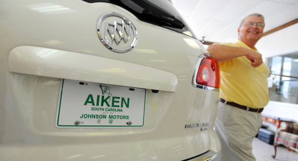 Mar. 29 2010- Graniteville Georgia U.S.- Rainier Ehrhardt  Staff..Salesperson Mike Mc Mullen leans against a Buick Enclave