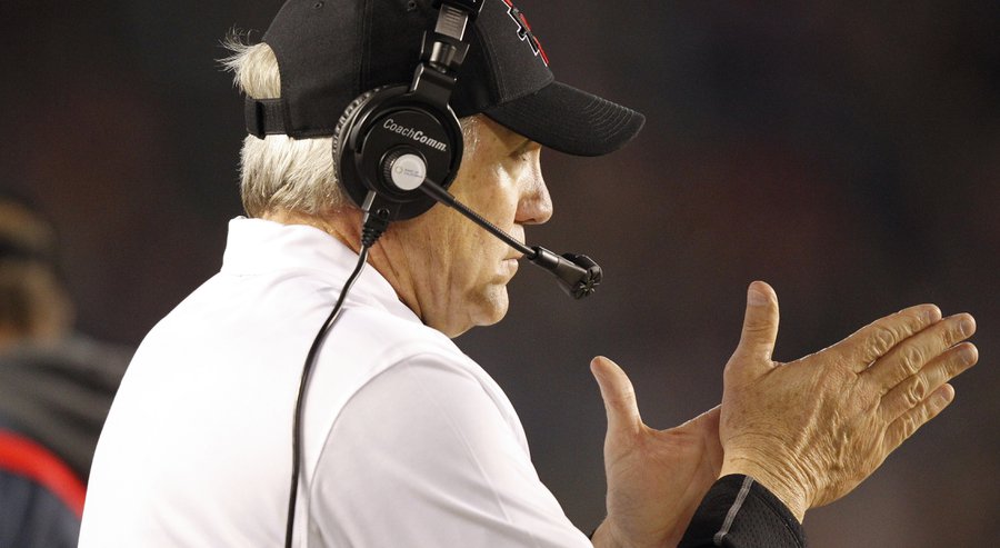 Aztecs coach Rocky Long rubs his hands while watching his players play Air Force in the first quarter