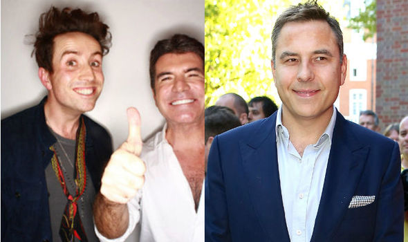 Nick Grimshaw and Simon Cowell pose at BBC studio