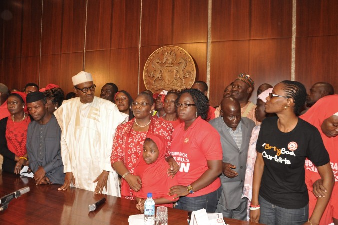 Nigerian President Muhammadu Buhari second left meets with members of the'Bring Back Our Girls campaign that was started after Nigerian extremist adducted girls form a Nigerian school at the presidential residence in Abuja Nigeria Wednesday July 8