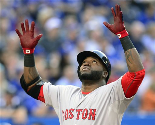 Boston Red Sox's David Ortiz celebrates his three run home run against the Toronto Blue Jays during the first inning of a baseball game Thursday