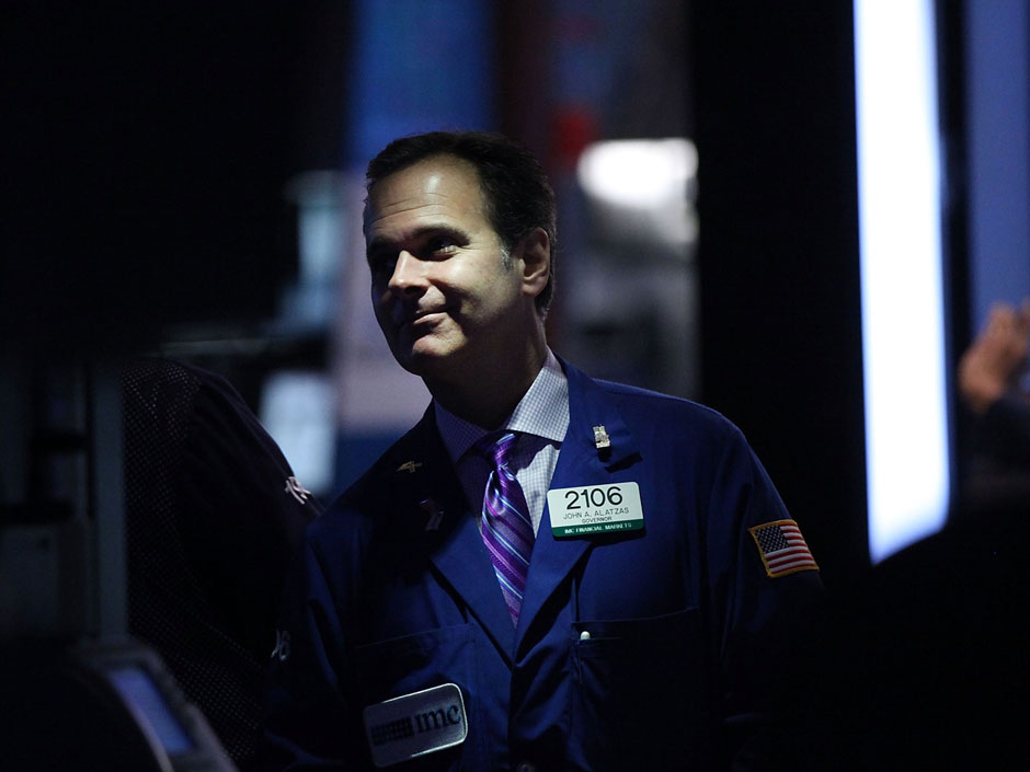 A trader works on the floor of the New York Stock Exchange. Wall Street edged slightly higher in trading Tuesday morning