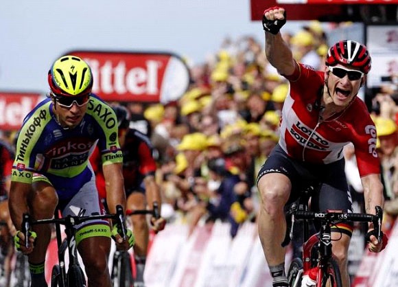 Lotto-Soudal rider Andre Greipel of Germany celebrates as he wins ahead of Tinkoff Saxo rider Peter Sagan of Slovakia at the 166-km second stage of the 102nd Tour de France cycling race from Utrecht to Zeeland yesterday. REUTERS  BE