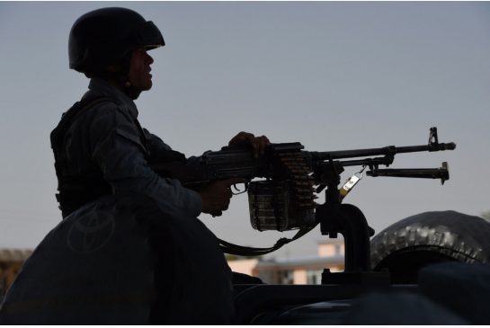 An Afghan policeman keeps watch at the site of a suicide bomb attack on a branch office of the National Directorate of Security in Kabul last week