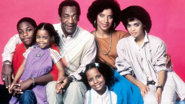 The Cosby Show cast on pink background