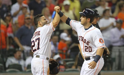 Houston Astros&#039 Preston Tucker is greeted at the plate by Jose Altuve left after his two-run home run against the Boston Red Sox during the fifth inning of a baseball game Wednesday