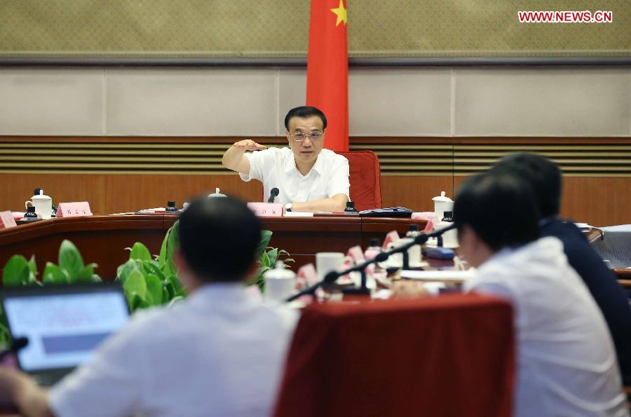 Chinese Premier Li Keqiang speaks during a meeting with economists and entrepreneurs in Beijing capital of China