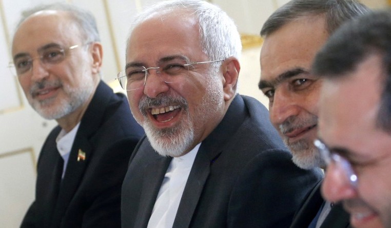 Iranian Foreign Minister Javad Zarif  laughs at the start of a meeting on Iran's nuclear program with US Secretary of State John Kerry in Vienna Austria