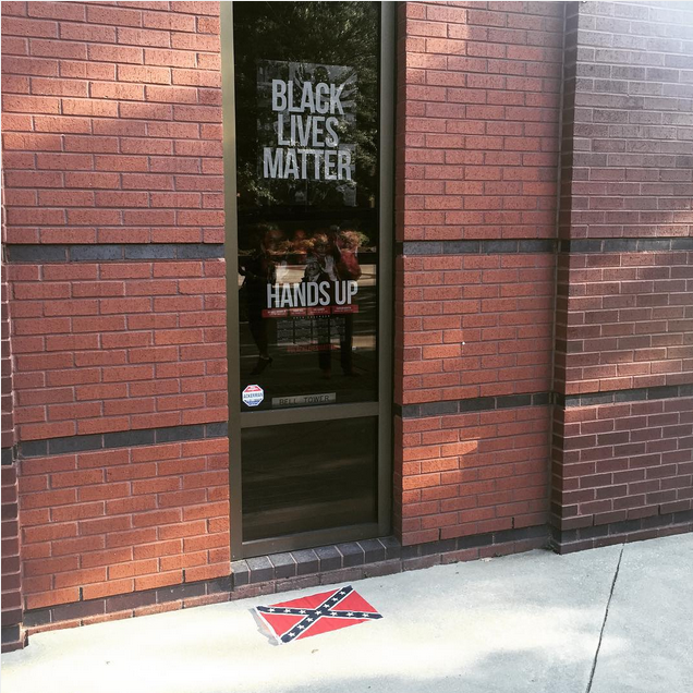 Confederate flag at Ebenezer Baptist Church under'Black Lives Matter sign. Dorian Warren