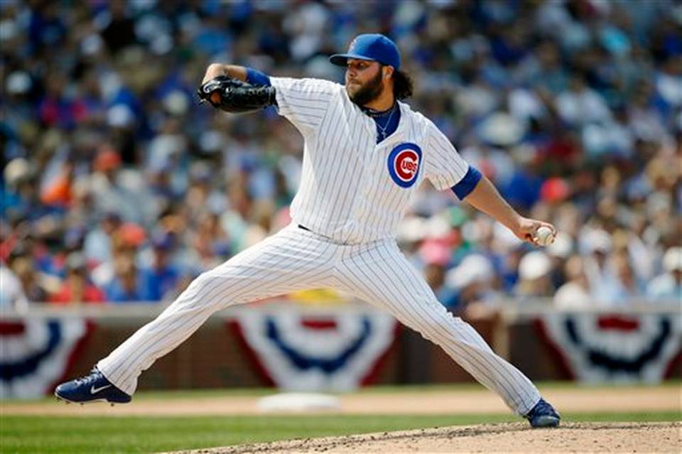 Chicago Cubs relief pitcher James Russell throws against the Miami Marlins during the eighth inning of a baseball game on Friday