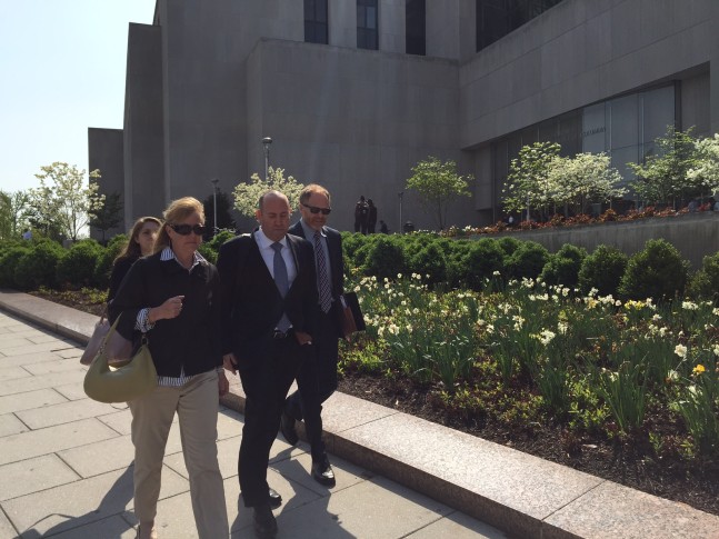 Daniel Rosen center flanked by his wife and his lawyer leaves D.C. Superior Court in April 2015