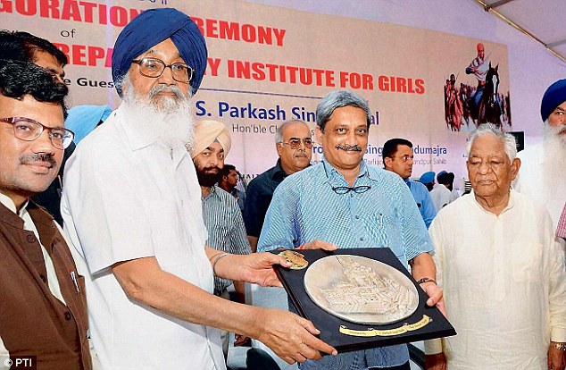 Defence Minister Manohar Parrikar with Punjab Chief Minister Parkash Singh Badal in Mohali on Saturday. He said the government will soon relax norms for women aspirants to join the Indian Army