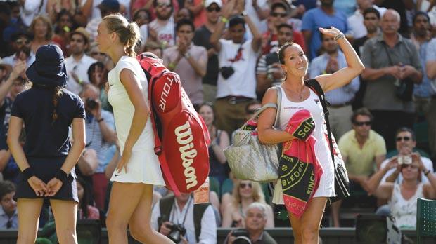 Jelena Jankovic acknowledges the crowd’s cheers as Petra Kvitova exits the court