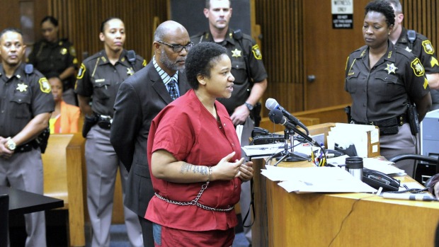 Mitchelle Blair is surrounded by Wayne County Sheriff's deputies and commanders as she addresses the court before her sentencing Friday