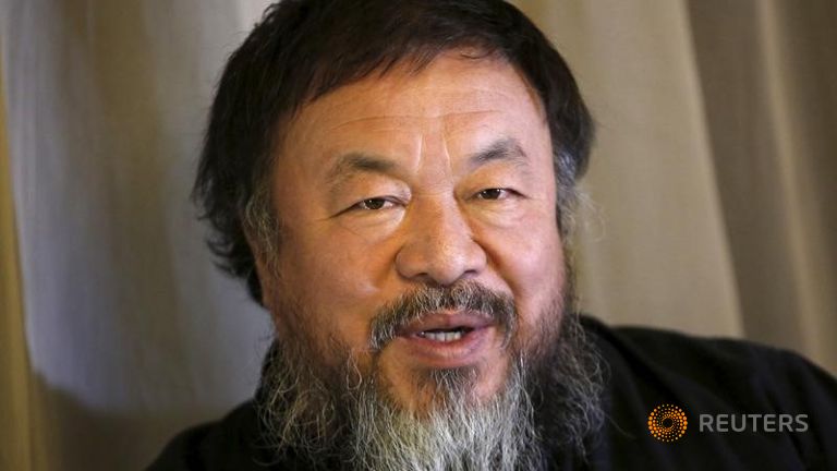 Dissident Chinese artist Ai Weiwei speaks during an interview with Reuters at his hotel in Beijing