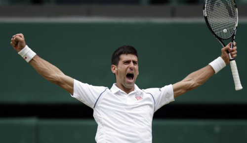 Novak Djokovic of Serbia celebrates winning the mens singles final against Roger Federer of Switzerland at the All England Lawn Tennis Championships in Wimbledon London