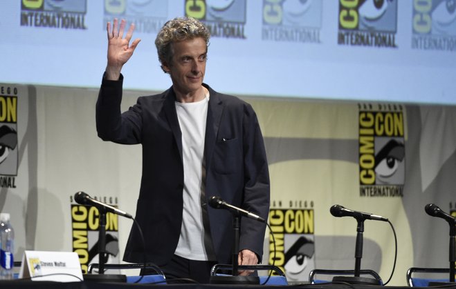 Peter Capaldi walks on stage at the'Doctor Who panel on day 1 of Comic Con International on Thursday