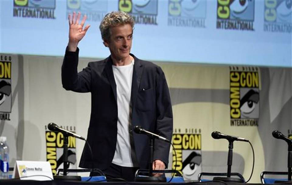 Peter Capaldi walks on stage at the'Doctor Who panel on day 1 of Comic Con International on Thursday