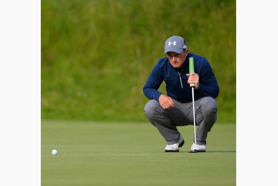 Irish amateur golfer Paul Dunne lines up his putt on the 8th green during his third round 66 on day four of the 2015 British Open Golf Championship on the Old Course at St Andrews in Scotland