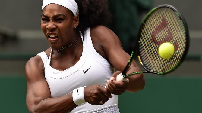 479654996-player-serena-williams-returns-against-us-player-venus