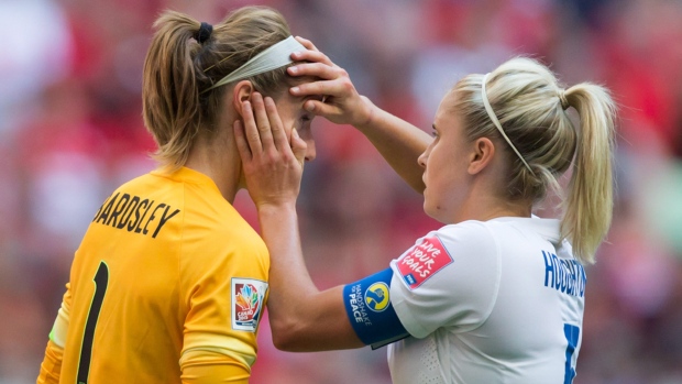 England goalkeeper Karen Bardsley left,being checked by teammate Steph Houghtin was forced out of the England Canada quarter-final game by an eye inflammation but is expected to be o.k. for Wednesday's semifinal