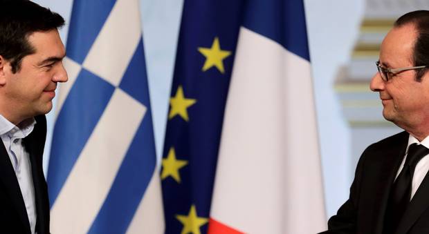 French President Francois Hollande and Greek Prime Minister Alexis Tsipras at a meeting at the Elysee Palace in Paris. Hollande stated during the visit by Alexis Tsipras that European Union rules and debt commitments must apply to all