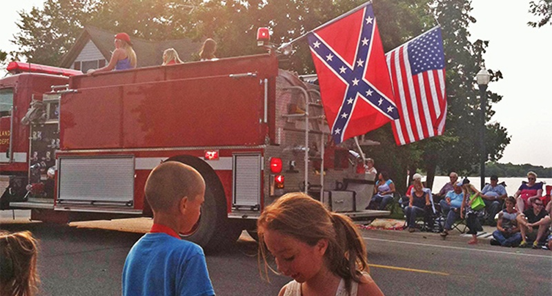 A Confederate flag was flown on the back of the Minnesota firetruck- via Twitter