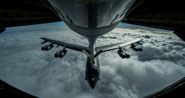 A B-52 Stratofortress is refueled in-flight over the Pacific Ocean