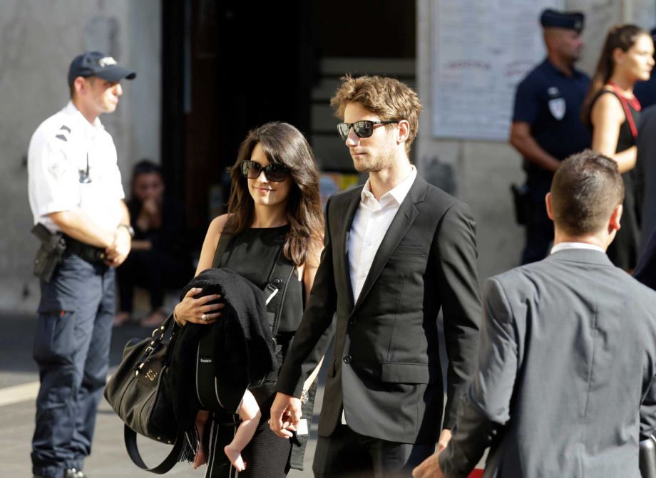 Lotus driver Romain Grosjean of France and Marion Jolles arrive at the Sainte Reparate Cathedral to attend the funeral of French Formula One driver Jules Bianchi in Nice French Riviera Tuesday