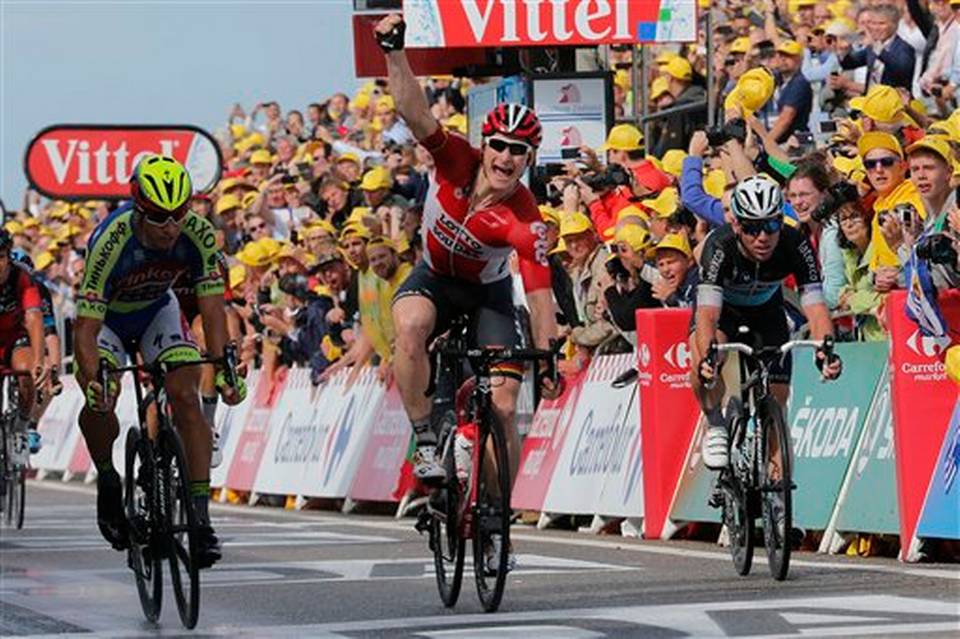 Germany's Andre Greipel crosses the finish line ahead of Peter Sagan of Slovakia left and Britain's sprinter Mark Cavendish right to win the second stage of the Tour de France cycling race over 166 kilometers with start in Utrecht