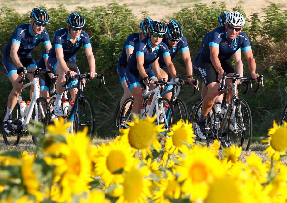 Lance Armstrong right rides as he joins former England soccer player Geoff Thomas and his team of ten amateur riders for two stages of the'Le Tour One Day Ahead Thursday