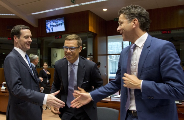 George Osborne left shakes hands with Dutch Finance Minister Jeroen Dijsselbloem during a meeting of EU finance ministers