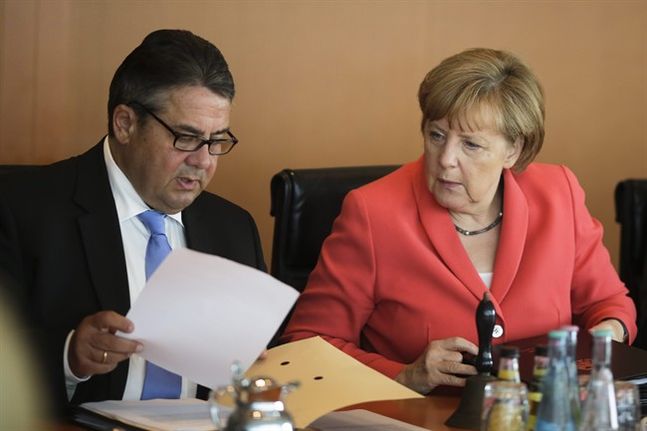 German Chancellor Angela Merkel right and Vice Chancellor and Economy Minister Sigmar Gabriel attend the weekly cabinet meeting at the chancellery in Berlin Wednesday