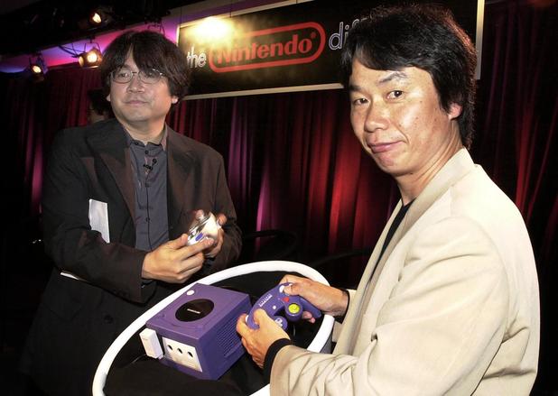 Satoru Iwata & Shigeru Miyamoto with a Nintendo Game Cube in 2001