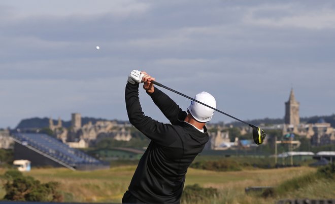 Another wild day at British Open finds Johnson calm, and in the lead | Reading