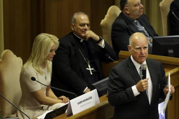 California Gov. Jerry Brown right delivers his speech