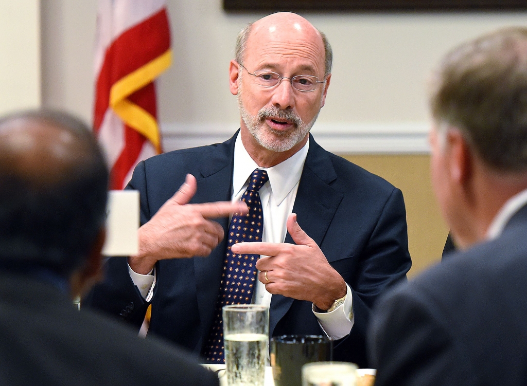 20150720radGovWolfBiz04-3 Gov. Tom Wolf visits with people at his table Monday before speaking about taxes and growing the state economy at a breakfast meeting of the Pittsburgh Technology Council at the Rivers Club