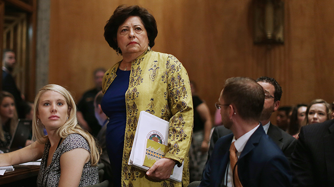 The Office of Personnel Management Director Katherine Archuleta arrives late for a hearing of the Senate Homeland Security and Governmental Affairs Committee about the recent OPM data breach in the Dirksen Senate Office Building on Capitol Hill