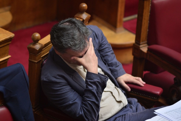 Greek finance minister Euclid Tsakalotos looks downcast