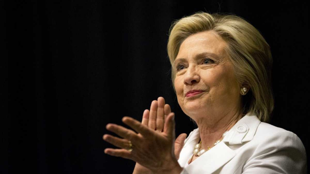 Democratic presidential candidate Hillary Rodham Clinton listens to a speaker during a campaign stop Wednesday